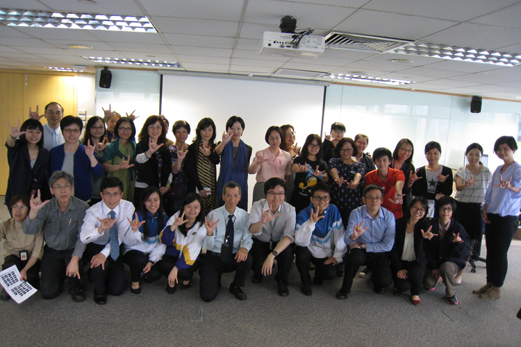 Colleagues saying “I Love You” in sign language 